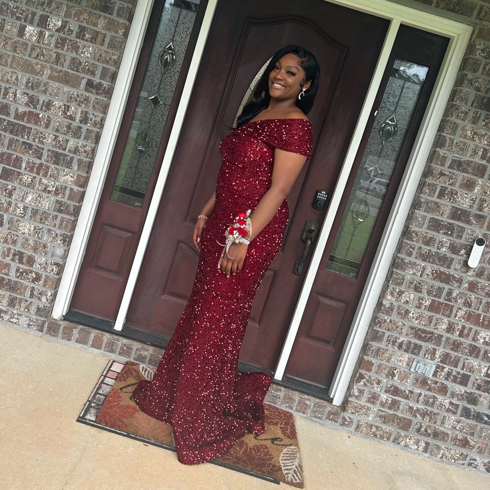 Burgundy body fitting prom dress. Shows all of your curves!